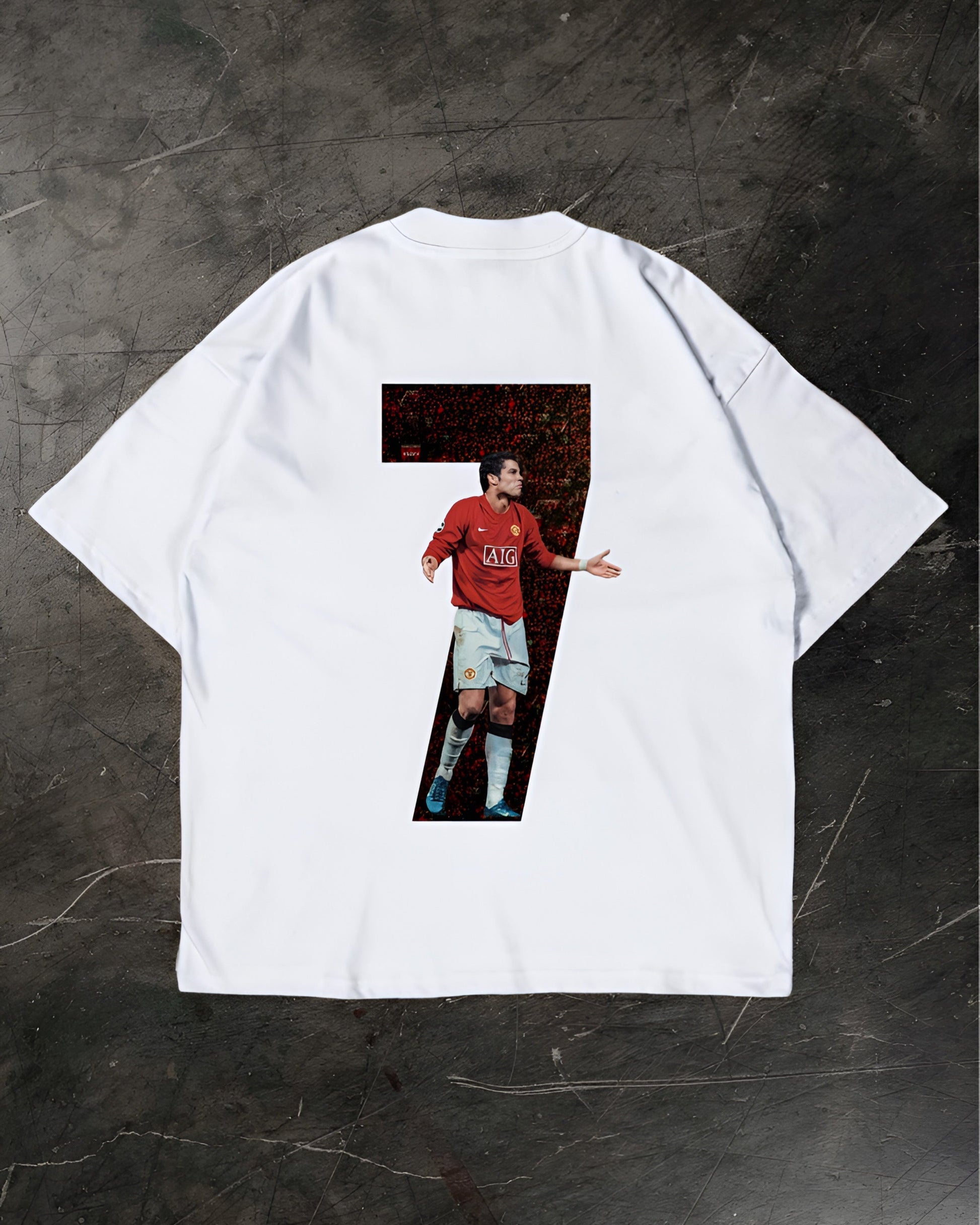 White t-shirt with a graphic of a Cristiano Ronaldo on a dark textured background