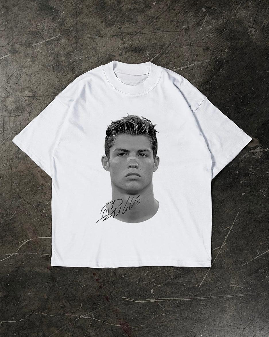 White t-shirt with a graphic of a Cristiano Ronaldo on a textured dark background