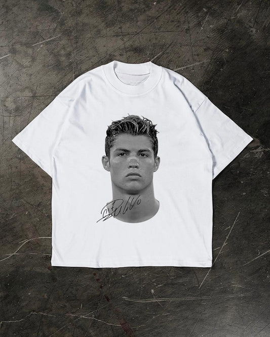 White t-shirt with a graphic of a Cristiano Ronaldo on a textured dark background
