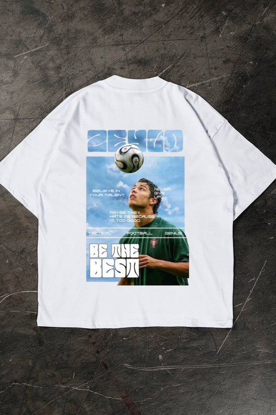 White t-shirt with a graphic of a Cristiano Ronaldo and text on a dark textured background