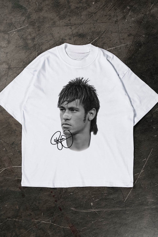 White t-shirt with a graphic of a Neymar Jr and signature on a dark textured surface