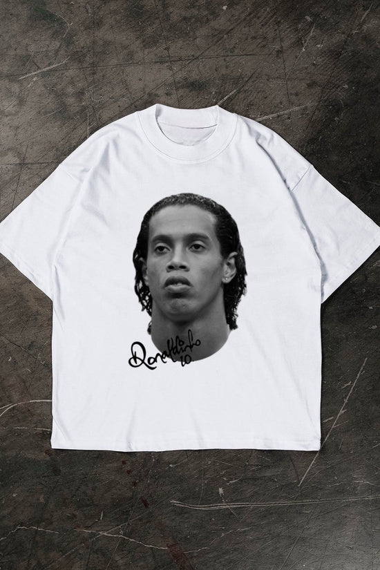 White t-shirt with a Ronaldinho on a textured dark surface